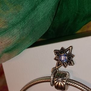 Pandora Bracelet with 3 charms, a safety chain, and 2 bangles.